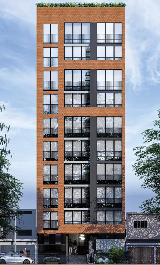 Fachada frontal de Green Time con acabado de ladrillo y balcones.